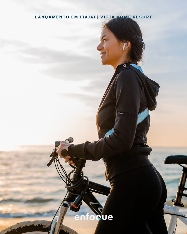 Vitta Home Resort launch piece, a woman with a bicycle by the sea.