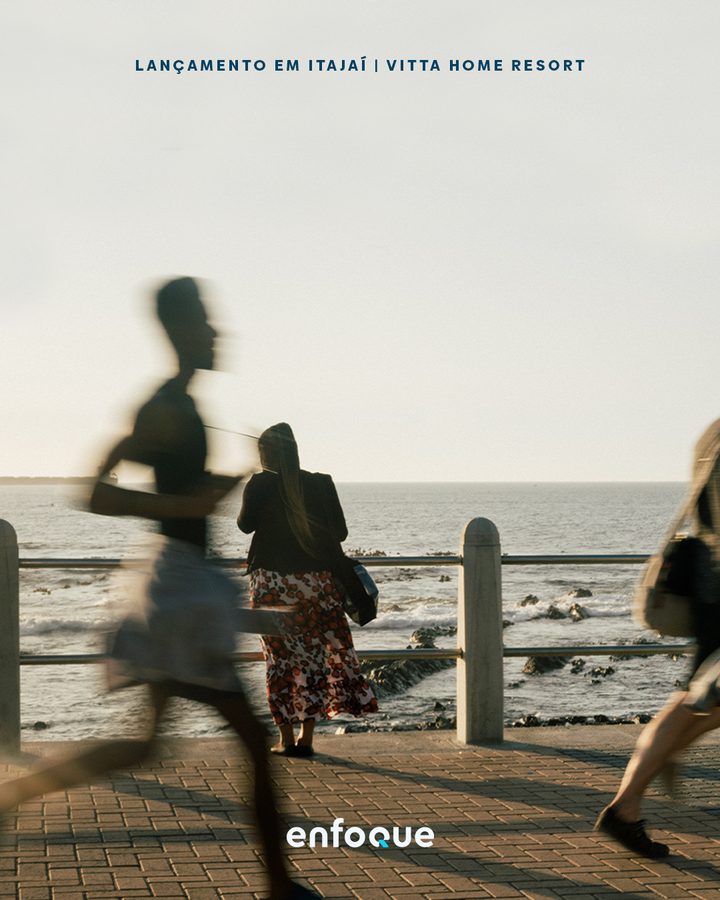 Vitta Home Resort launch piece, people walking along the seafront.