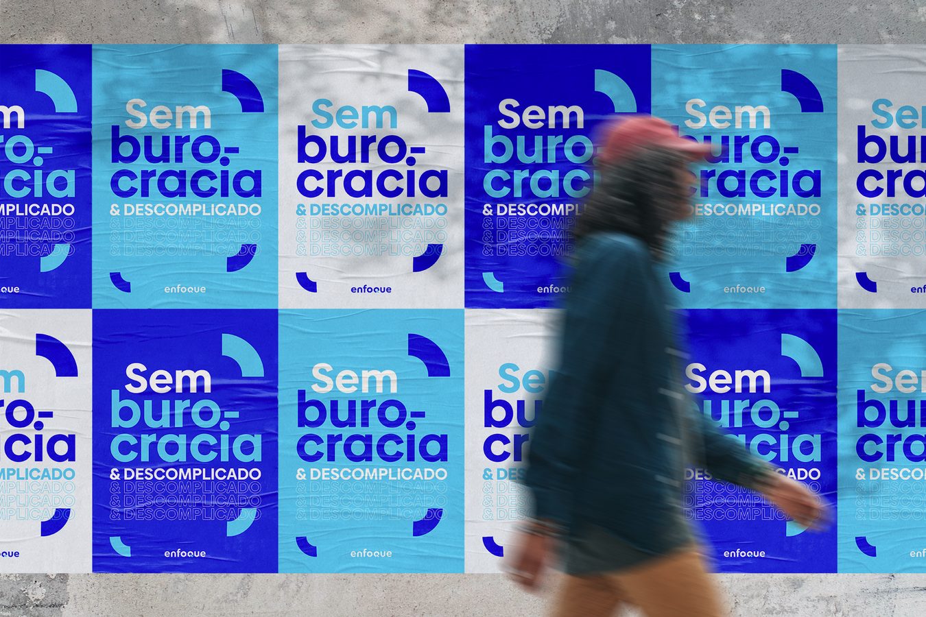 Campaign posters pasted on a street wall.